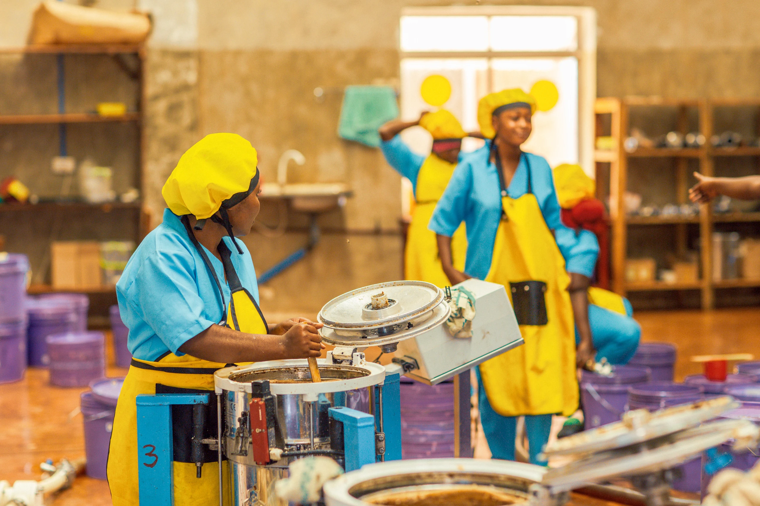 Two women working in the Kigoma processing room